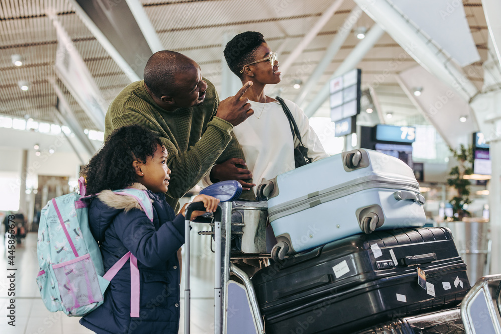 Tourist family waiting at international airport Tourist family waiting at international airport