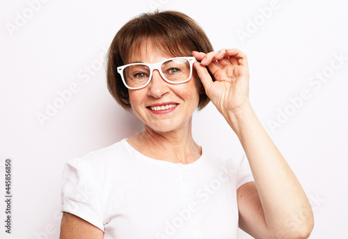 Smiling senior woman wearing glasses and smiling