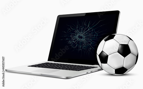 Soccer ball and broken laptop screen
