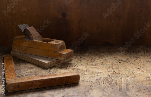 Woodworking tools on wooden table. Wood plane jointer carpenter tools or joiner tool as still life
