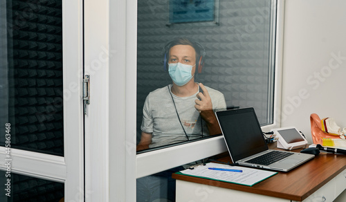 Adult man getting a hearing test at audiology center. Audiometry, hearing check up