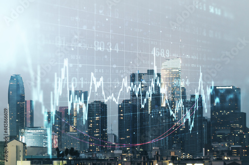 Abstract virtual financial graph hologram on Los Angeles cityscape background  financial and trading concept. Multiexposure