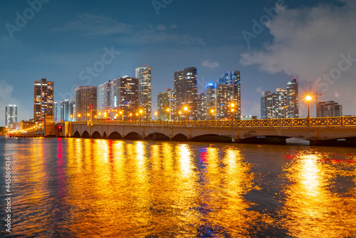 City of Miami Florida  sunset panorama with business and residential buildings and bridge on Biscayne Bay. Skyline night view.