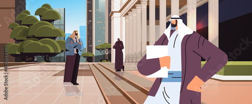 arab businesspeople lawyers standing near government building with columns law and justice legal advice concept