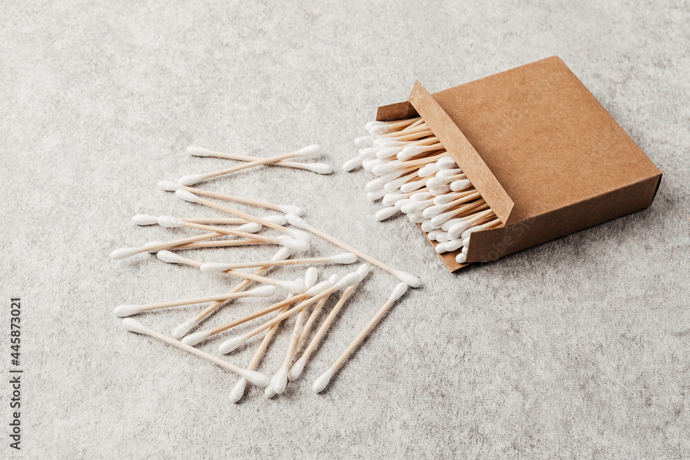 Bamboo cotton buds in carton box. Ethical, sustainable, no plastic lifestyle idea. Top view, mockup