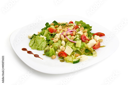 Vegetarian salad with mozzarella cheese, isolated on white background. High resolution image.
