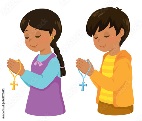 Christian Hispanic kids praying with a rosary cross.