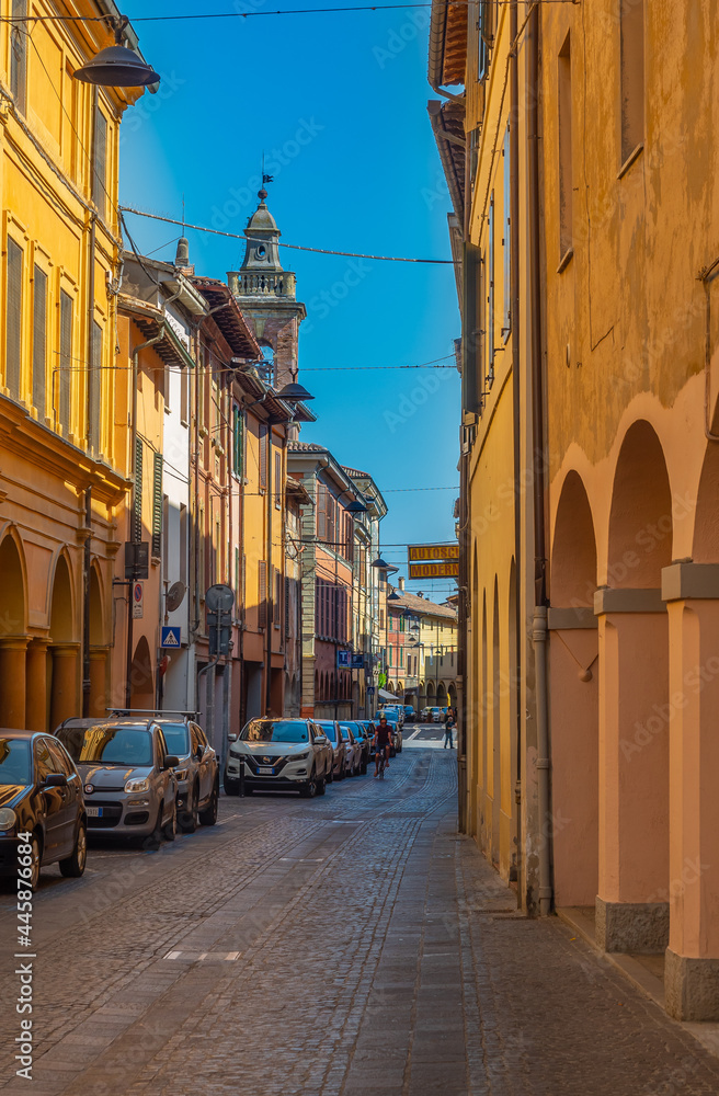 Fototapeta premium Such narrow and colorful streets can be found in many Italian towns, but the one you see here can be found in Meldola located in the Emilia Romagna region.