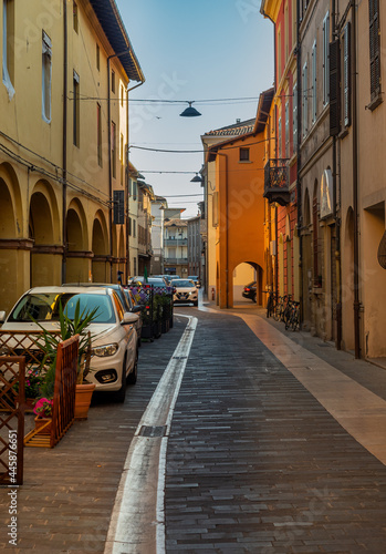 Fototapeta Naklejka Na Ścianę i Meble -  Such narrow and colorful streets can be found in many Italian towns, but the one you see here can be found in Meldola located in the Emilia Romagna region.
