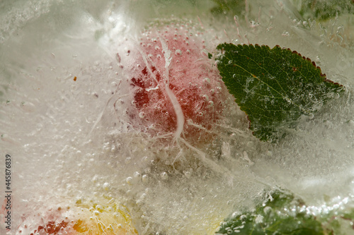 Ice texture with small round plums inside the layer of ice 