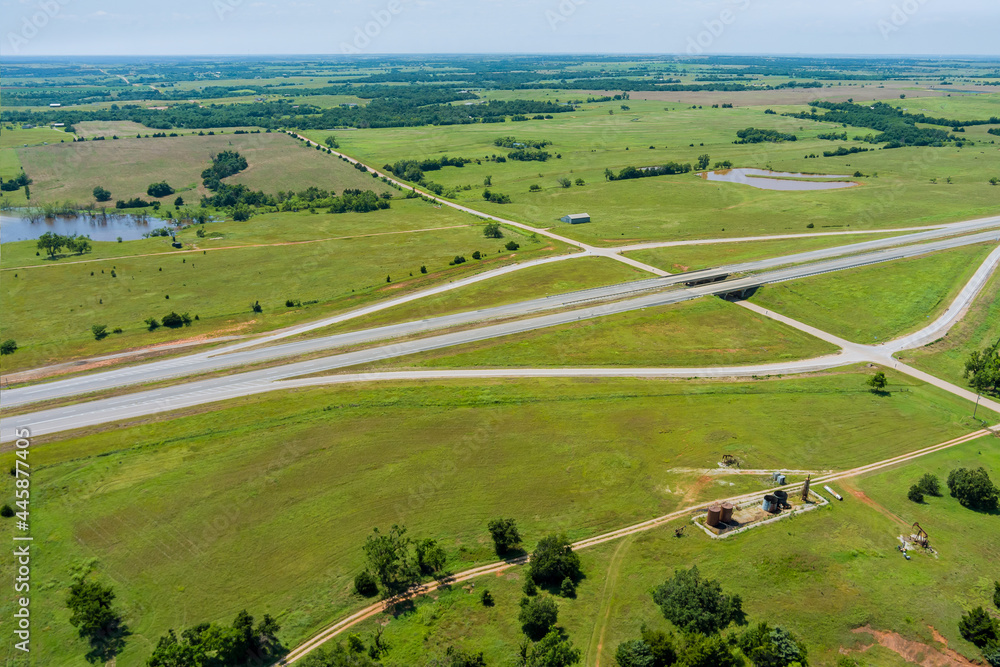 Obraz premium Aerial view panorama of original the historic Route 66 road near oil pump in the countryside across Clinton Oklahoma