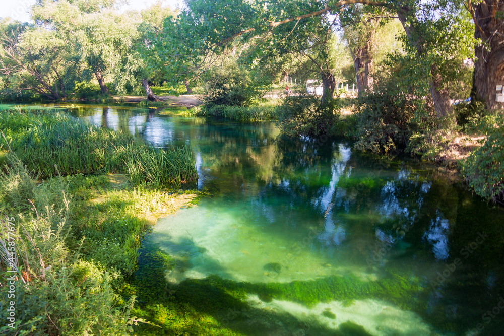 On the banks of the river Tirino. Clear, transparent water. A beautiful landscape in the province of L'Aquila in Abruzzo On the banks of the river Tirino. Clear, transparent water. A beautiful landscape in the province of L'Aquila in Abruzzo