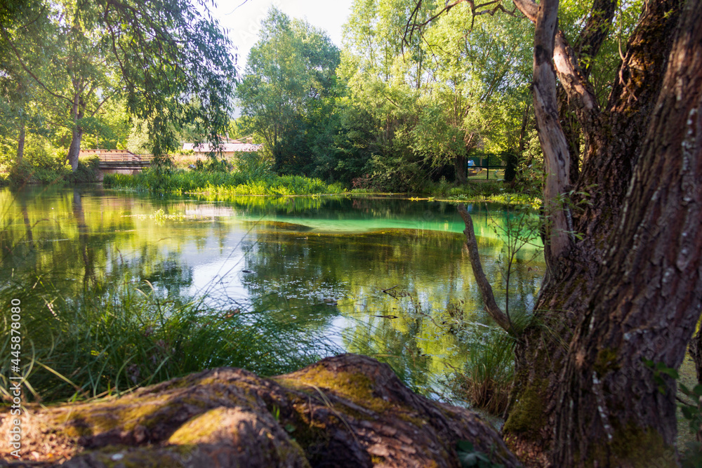 On the banks of the river Tirino. Clear, transparent water. A beautiful landscape in the province of L'Aquila in Abruzzo On the banks of the river Tirino. Clear, transparent water. A beautiful landscape in the province of L'Aquila in Abruzzo