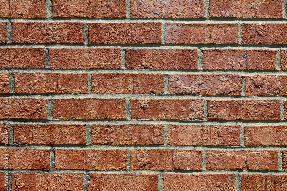 Fototapeta premium A close view of the red brick surface textures.