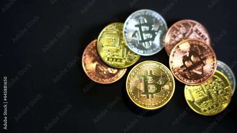 Shiny bitcoine crypto currency with moving light reflective on black background Shiny bitcoine crypto currency with moving light reflective on black background
