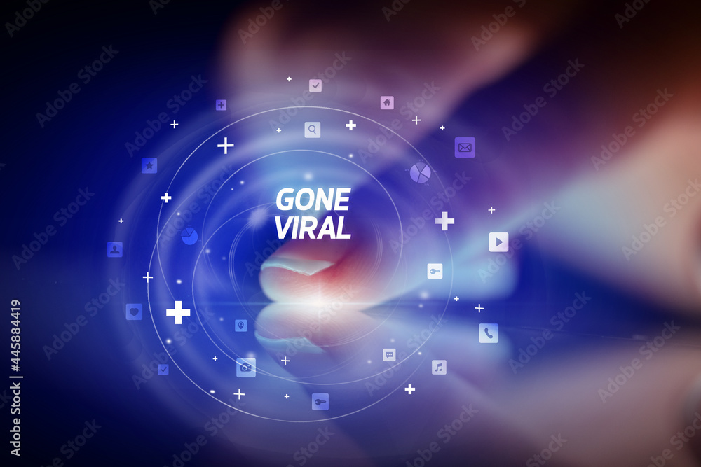 Finger touching tablet with social media icons concept Finger touching tablet with social media icons concept