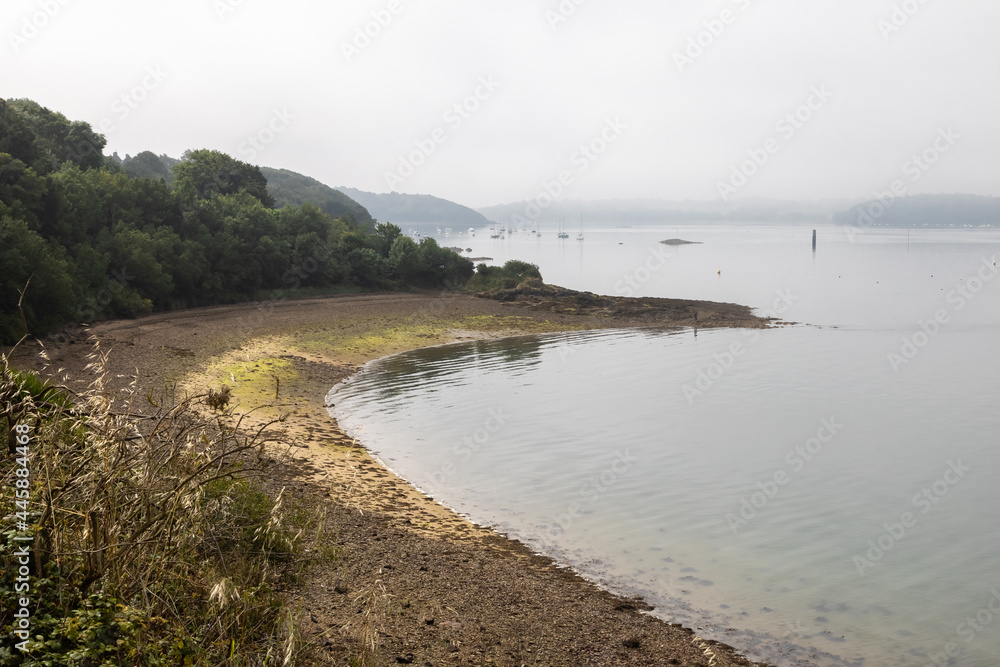 the right bank of the Rance river in Saint Suliac, in the fog