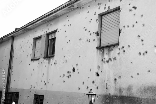 Houses in Mostar in Bosnia-Herzegovina, with holes in the walls, caused by the conflict
