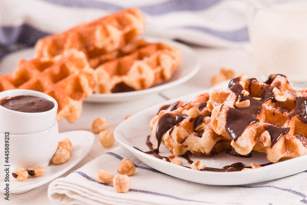 Waffles with chocolate cream and hazelnuts. Waffles with chocolate cream and hazelnuts.