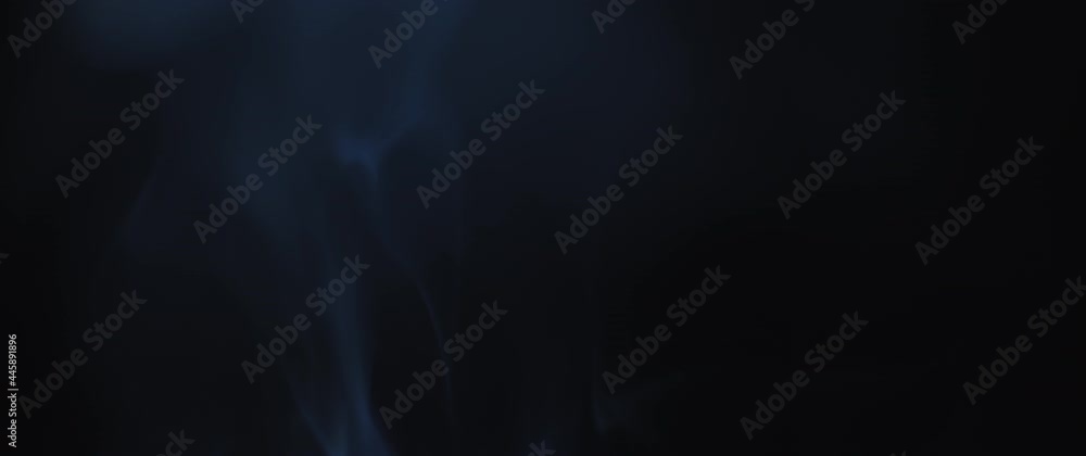 Blue incense smoke swirling on black background in slow motion. Blue incense smoke swirling on black background in slow motion.