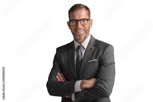 Fotografia Middle aged businessman wearing suit and tie while standing a isolated white bac