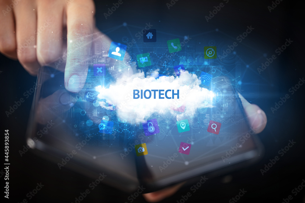 Businessman holding a foldable smartphone, technology concept Businessman holding a foldable smartphone, technology concept
