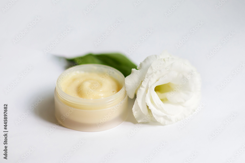 Cream in a jar on a white background Cream in a jar on a white background
