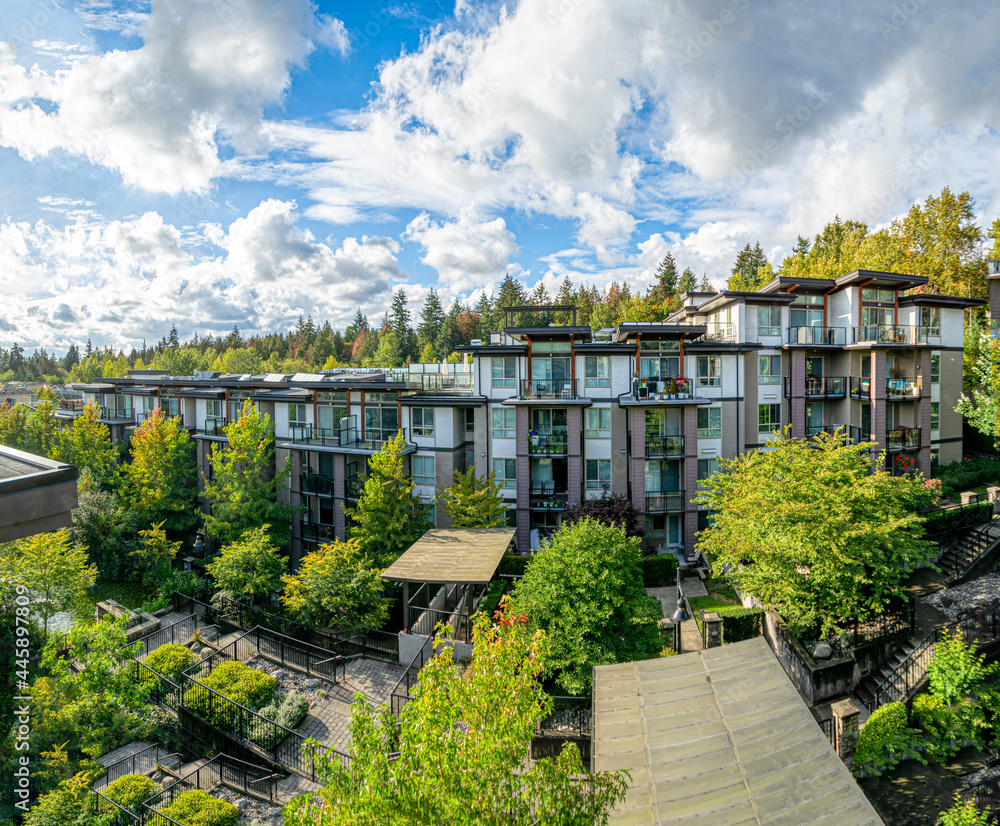 Panoramic veiw of residential building on cloudy sky background