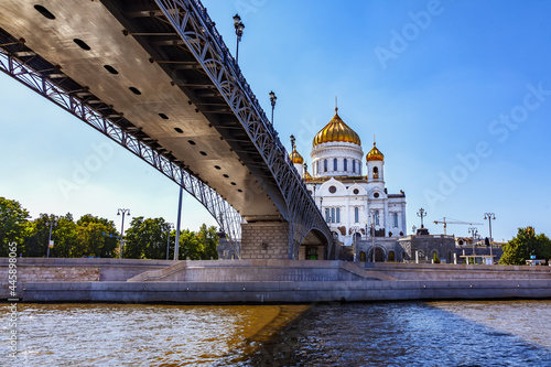 Cathedral of Christ the Savior on a sunny summer day. View from the Moskva River from under the Patriarchal Bridge. Moscow, Russia, July 2021