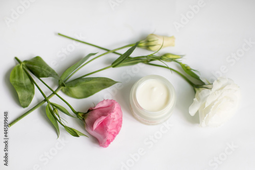 Cream in a jar on a white background