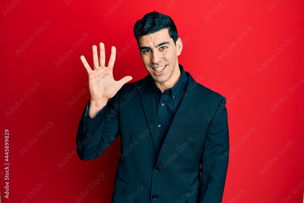 Handsome hispanic man wearing business clothes showing and pointing up with fingers number five while smiling confident and happy. Handsome hispanic man wearing business clothes showing and pointing up with fingers number five while smiling confident and happy.