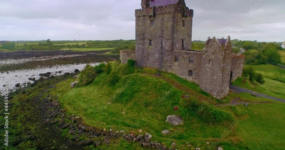 Aerial: Dunguaire Castle, a 16th-century tower house on the southeastern shore of Galway Bay in County Galway, Ireland. Aerial: Dunguaire Castle, a 16th-century tower house on the southeastern shore of Galway Bay in County Galway, Ireland.