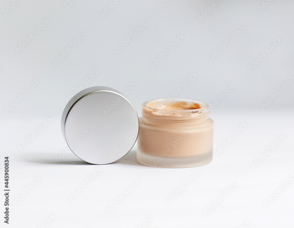 Cream in a jar on a white background Cream in a jar on a white background