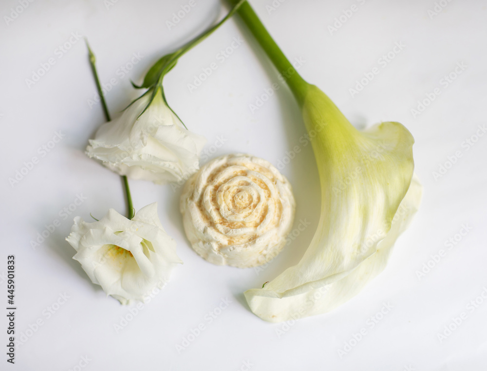 Handmade bath soap with flowers on a white background