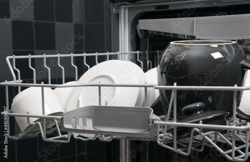 close-up, on the top grid, ceramic utensils in the dishwasher