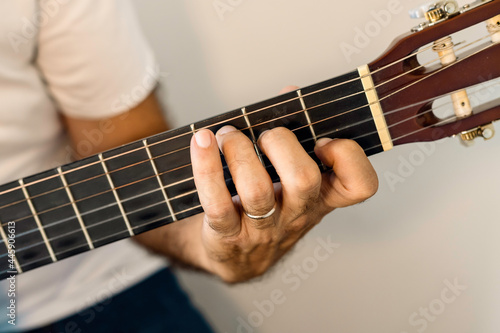 Guitar chord, C major chord. Male hand playing guitar chord