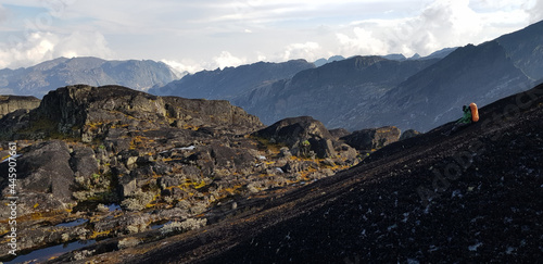 Rwenzori Mountains National Park, Uganda - February 27, 2020: Ugandan guide resting after descending from Weissman Peak photo