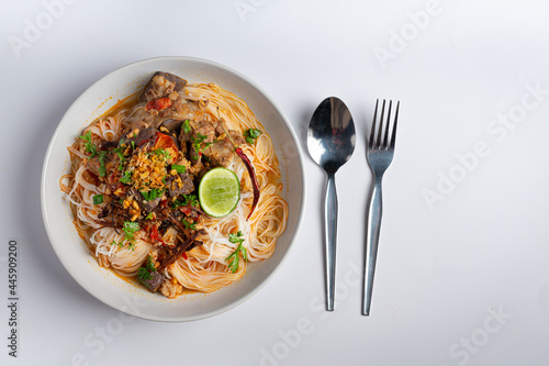 Rice noodles in fish curry sauce with vegetables