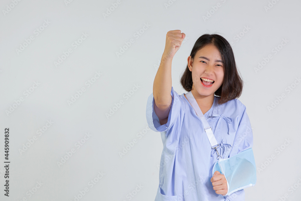 Broken arm girl in right arm sling thumbs up Woman showing pain from health care, broken arm and Broken arm girl in right arm sling thumbs up Woman showing pain from health care, broken arm and