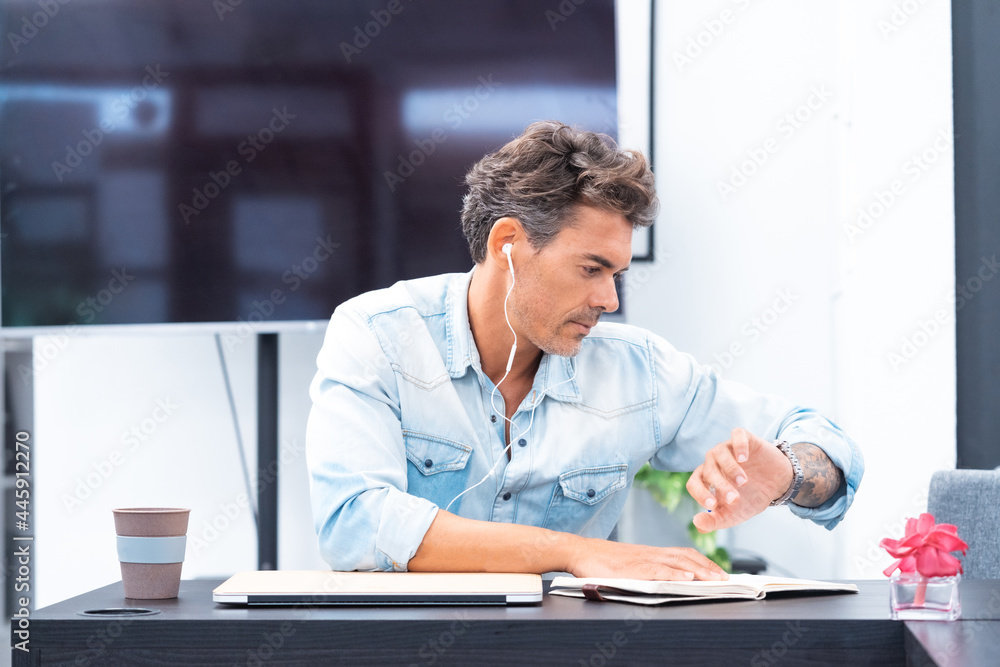 Portrait of Middle Age Attractive Man Working In Modern Office Portrait of Middle Age Attractive Man Working In Modern Office