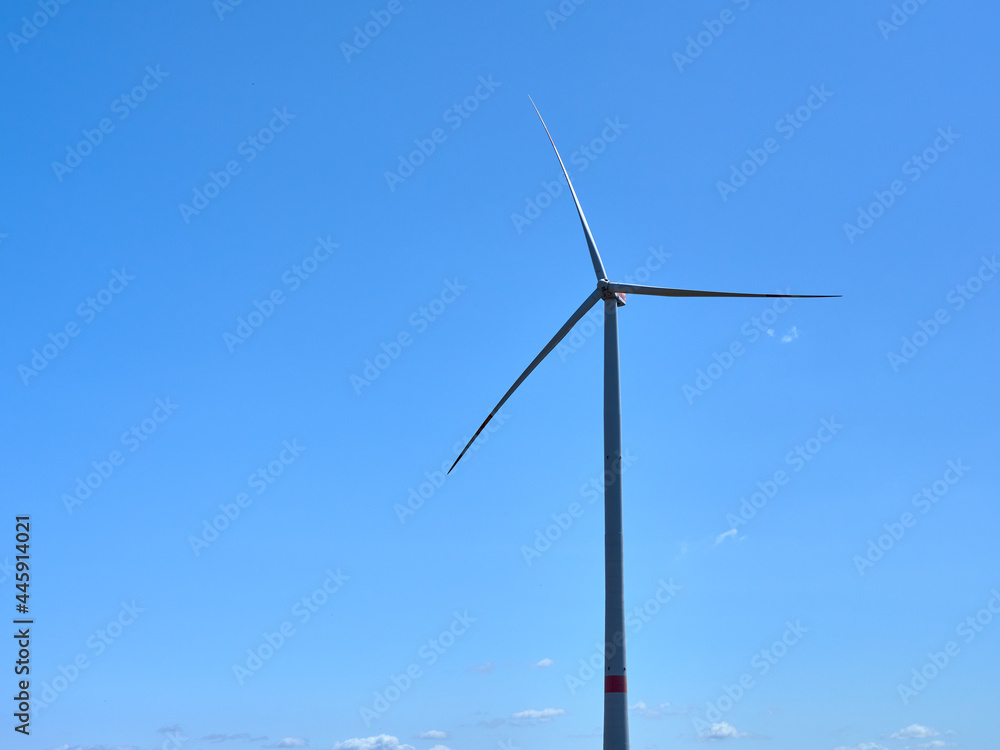 One wind power generator set against blue sky One wind power generator set against blue sky