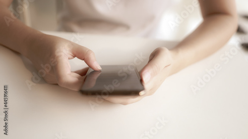 Woman holding Smartphone working mobile devices. cell telephone technology e-commerce concept.