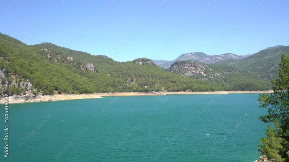 Green Canyon in Oymapinar Dam area Manavgat, Antalya, Turkey. Rocky shores with green trees in the Green Canyon. The largest artificial reservoir in Turkey. Green Canyon in Oymapinar Dam area Manavgat, Antalya, Turkey. Rocky shores with green trees in the Green Canyon. The largest artificial reservoir in Turkey.