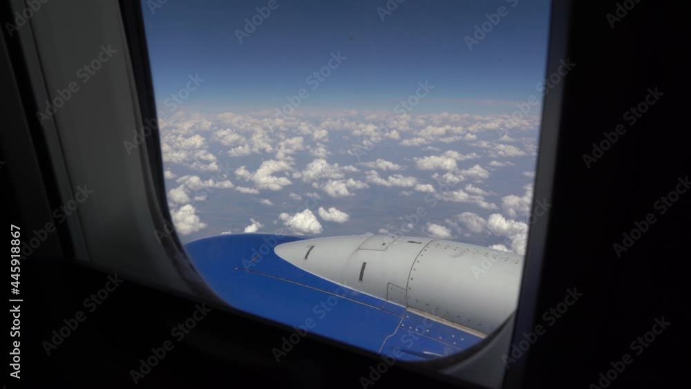 View from the airplane window. Flying above the clouds high in the sky. Travel concept. Development of tourism during a pandemic View from the airplane window. Flying above the clouds high in the sky. Travel concept. Development of tourism during a pandemic