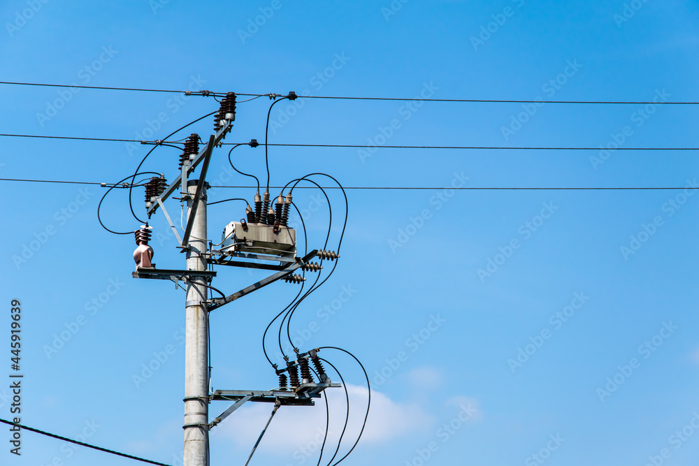 transformer on an electric pole on a background of blue sky transformer on an electric pole on a background of blue sky