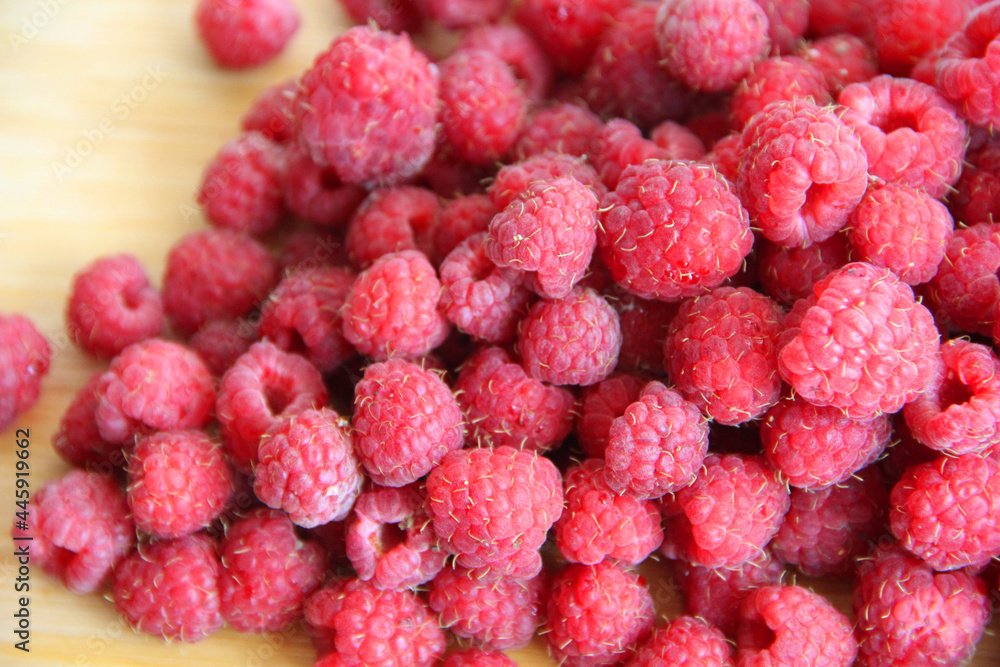 fresh raspberries on a white background close-up fresh raspberries on a white background close-up