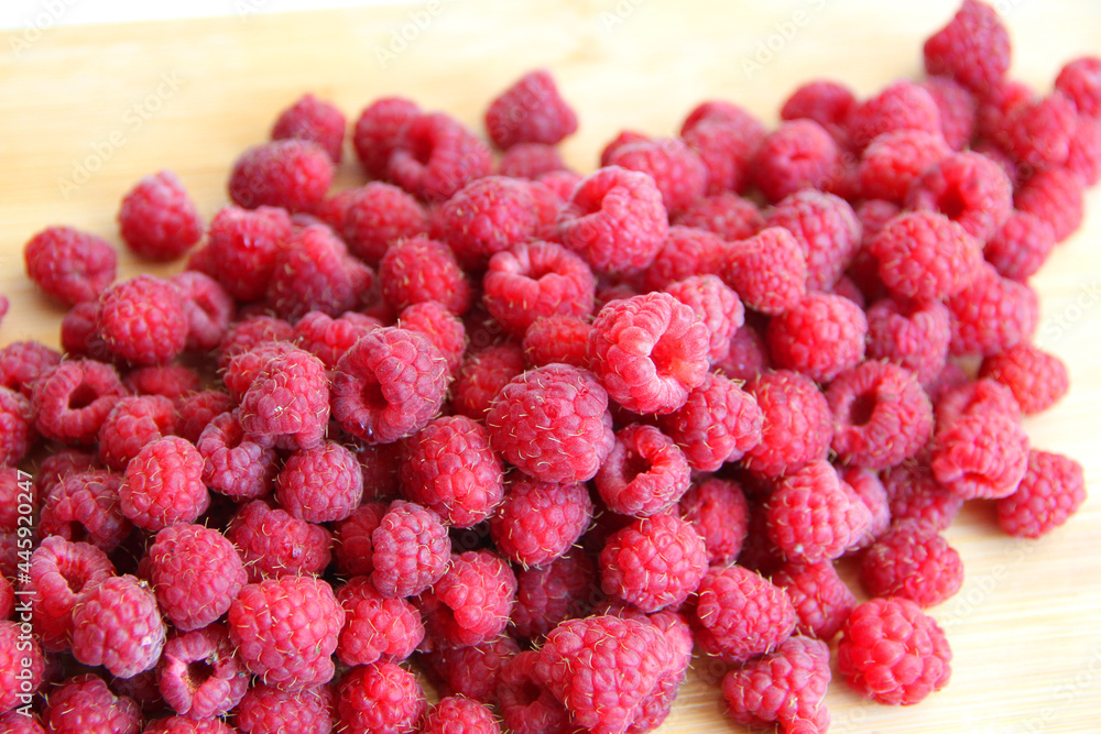 fresh raspberries on a white background close-up fresh raspberries on a white background close-up