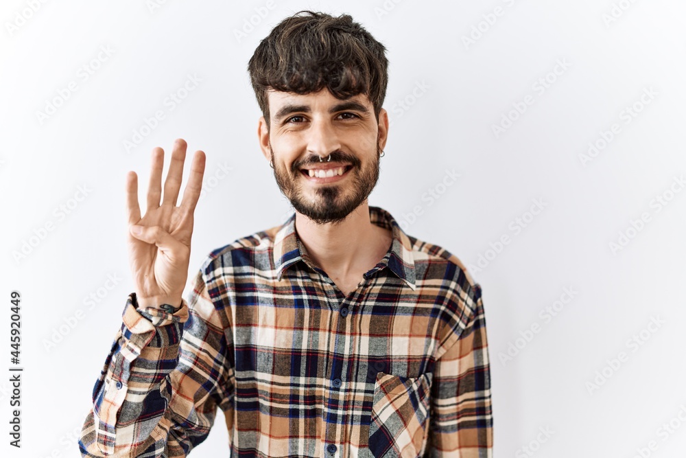 Hispanic man with beard standing over isolated background showing and pointing up with fingers number four while smiling confident and happy. Hispanic man with beard standing over isolated background showing and pointing up with fingers number four while smiling confident and happy.