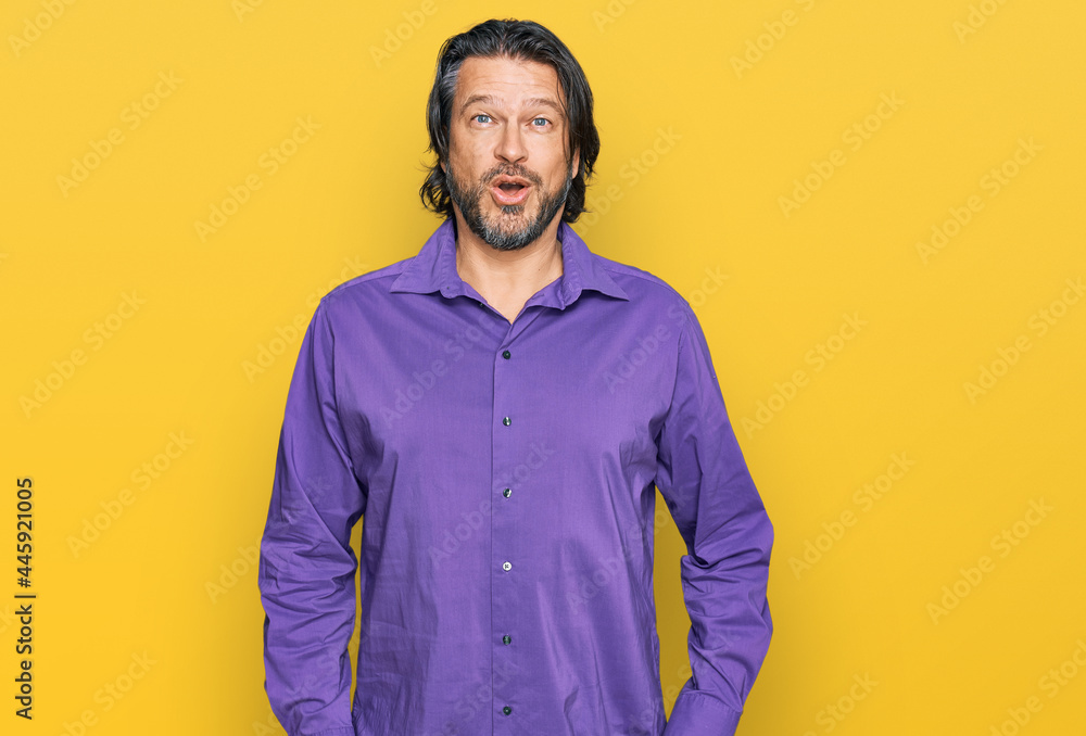 Middle age handsome man wearing business shirt afraid and shocked with surprise expression, fear and excited face. Middle age handsome man wearing business shirt afraid and shocked with surprise expression, fear and excited face.