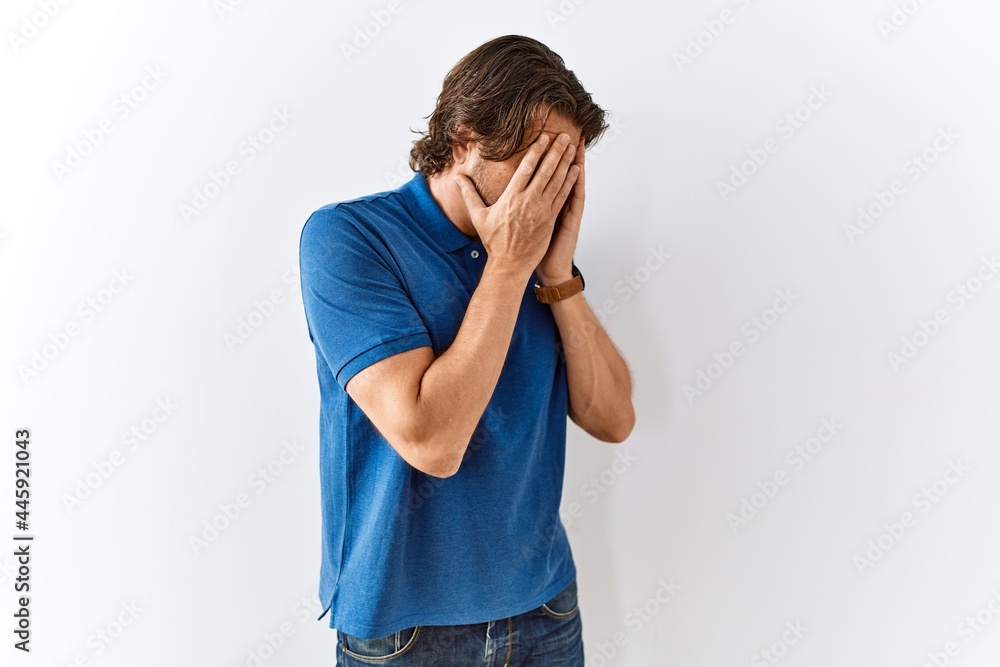 Handsome middle age man standing together over isolated background with sad expression covering face with hands while crying. depression concept. Handsome middle age man standing together over isolated background with sad expression covering face with hands while crying. depression concept.